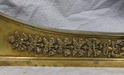 Bronze and brass fireplace surround from the Empire period, early 19th century.