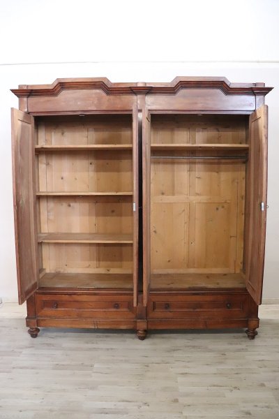Large antique wardrobe in solid walnut, Italy Mid 19th century
