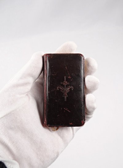 A small, pocket-sized parishioner's book, complete with offices and prayers during Holy Mass.