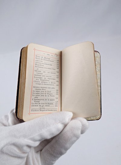 A small, pocket-sized parishioner's book, complete with offices and prayers during Holy Mass.