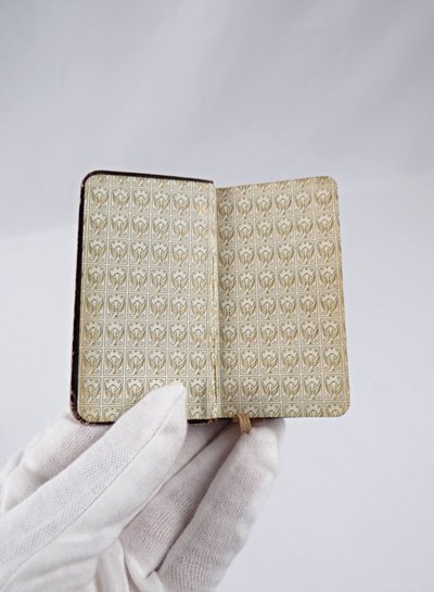 A small, pocket-sized parishioner's book, complete with offices and prayers during Holy Mass.