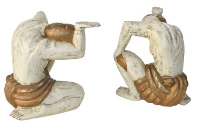 Coffee table with two figures holding a glass tray