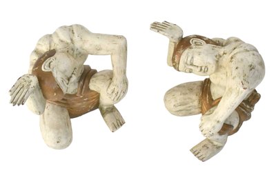 Coffee table with two figures holding a glass tray
