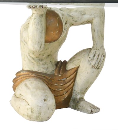 Coffee table with two figures holding a glass tray