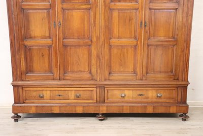 Very large 4 doors waedrobe in solid walnut, Italy Mid 19th century