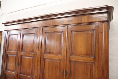Very large 4 doors waedrobe in solid walnut, Italy Mid 19th century