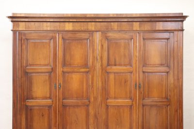 Very large 4 doors waedrobe in solid walnut, Italy Mid 19th century