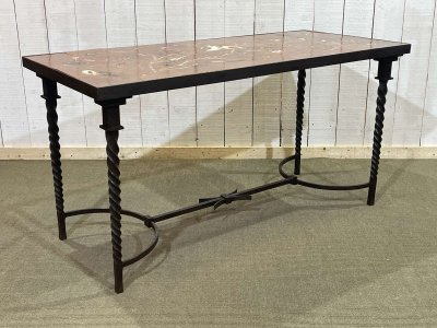 Wrought iron console table with a tiled earthenware top decorated with a seabed scene