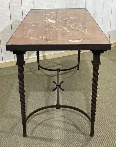 Wrought iron console table with a tiled earthenware top decorated with a seabed scene