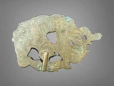 Embossed and finely engraved copper maedate featuring a dragon in clouds - Edo period. -