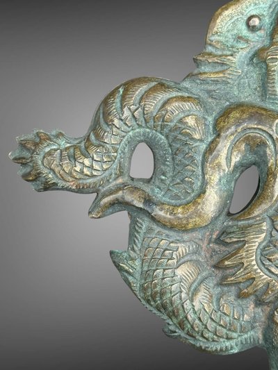 Embossed and finely engraved copper maedate featuring a dragon in clouds - Edo period. -