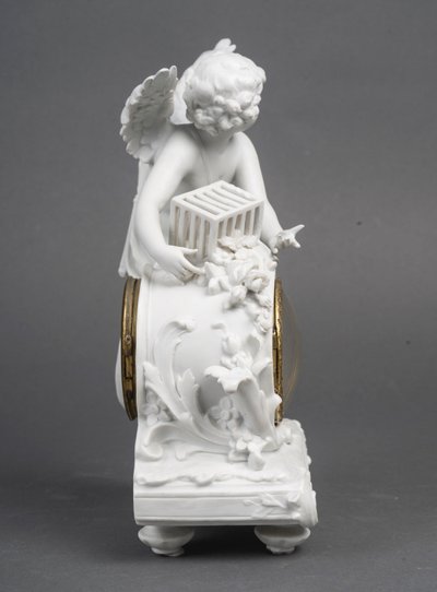 Piccolo orologio a biscotto di Sèvres, soggetto Cupido - periodo Art Nouveau