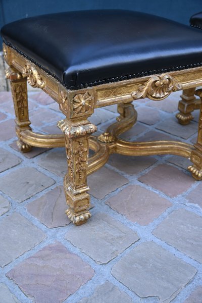 Pair of Louis XIV style gilded wood stools with struts