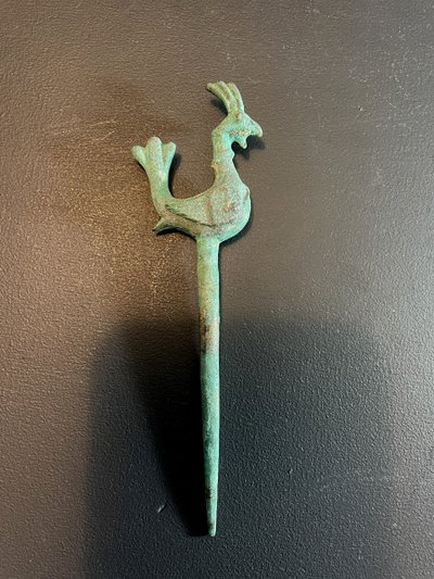 Bactria, 3rd century B.C., bronze hairpin decorated with a stylized bird.