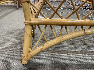 1960s rattan bed with its metal slatted base