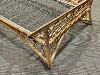 1960s rattan bed with its metal slatted base