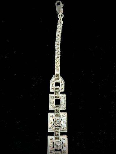 Art Deco bracelet in platinum and gold set with an emerald and 4.72 carats of diamonds