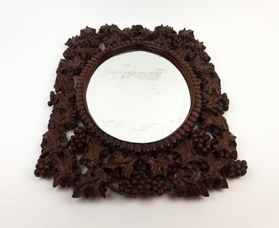 Miroir en bois sculpté