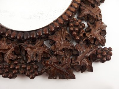 Miroir en bois sculpté