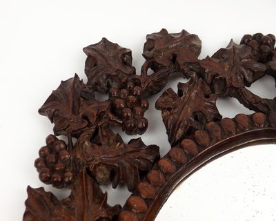 Miroir en bois sculpté