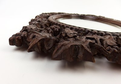 Miroir en bois sculpté