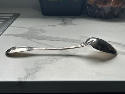 Solid silver "shell" style stew spoon, 18th century