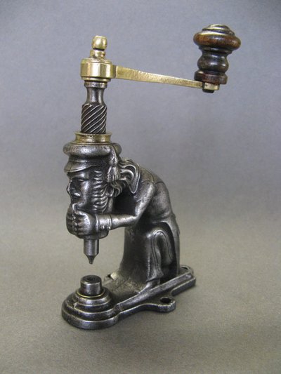 Anthropomorphic eyelet press, 19th century, circa 1800.