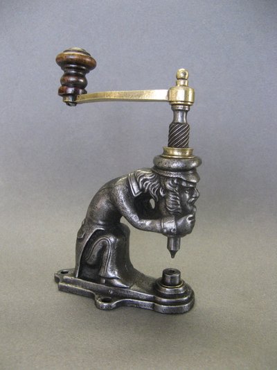 Anthropomorphic eyelet press, 19th century, circa 1800.