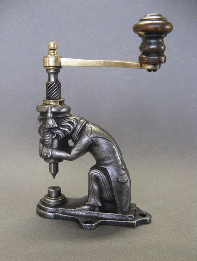 Anthropomorphic eyelet press, 19th century, circa 1800.