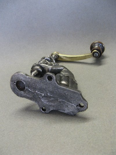 Anthropomorphic eyelet press, 19th century, circa 1800.