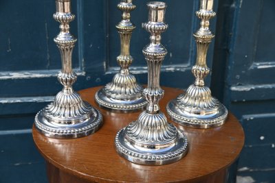 Suite of 4 Louis XVI silver-plated metal candlesticks