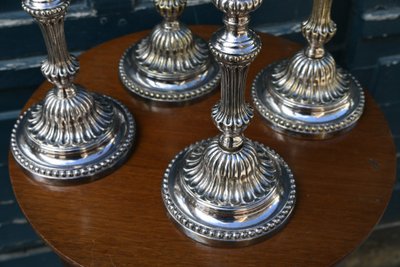 Suite of 4 Louis XVI silver-plated metal candlesticks