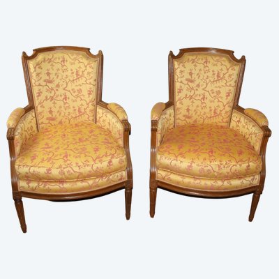 Pair of Louis XVI bergère armchairs in late 18th-century walnut