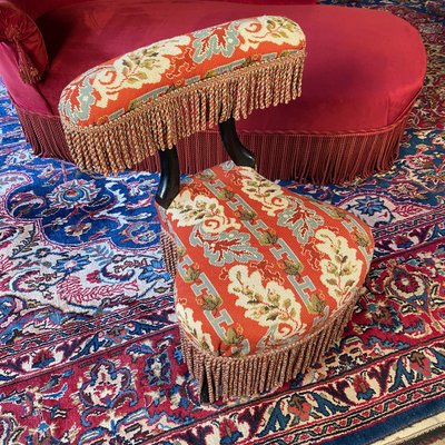 A Napoleon III period voyeur chair in blackened wood, upholstered in needlepoint tapestry
