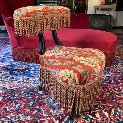 A Napoleon III period voyeur chair in blackened wood, upholstered in needlepoint tapestry