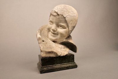 Stone sculpture Child's face 19th century on marble base