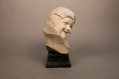 Stone sculpture Child's face 19th century on marble base