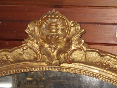 17th century Louis XIV style mirror in gilded wood.