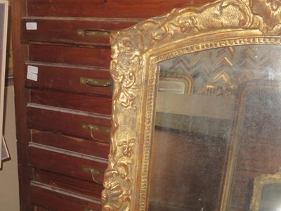 17th century Louis XIV style mirror in gilded wood.
