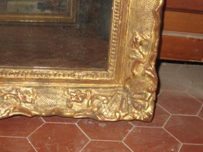 17th century Louis XIV style mirror in gilded wood.