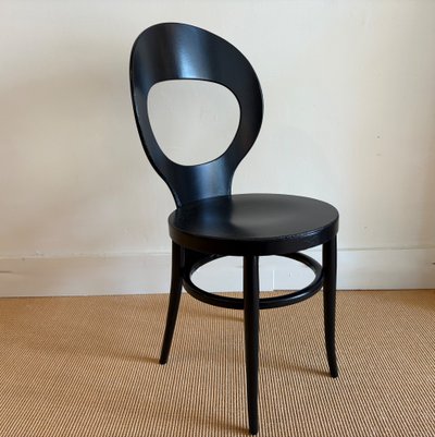 SUITE  DE 4 CHAISES BISTROT BAUMANN LAQUÉES NOIRES.
