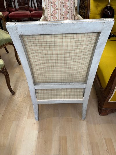 Fauteuil Époque Empire rechampi et doré. Décor de palmettes et rosace 