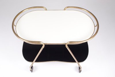 Carrello di Ilse Möbel, in ottone e Formica, anni '60.