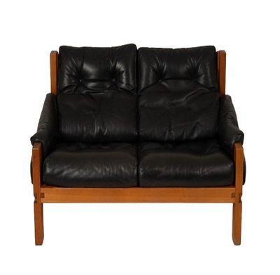 Pierre Chapo.  S22 two-seater sofa, in elm and black leather. 1970 LS6739
