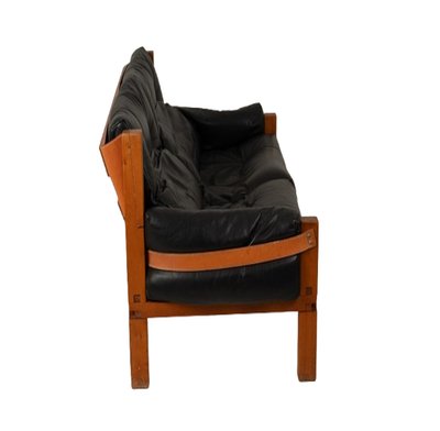 Pierre Chapo.  S22 two-seater sofa, in elm and black leather. 1970 LS6739