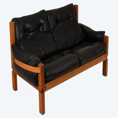 Pierre Chapo.  S22 two-seater sofa, in elm and black leather. 1970 LS6739
