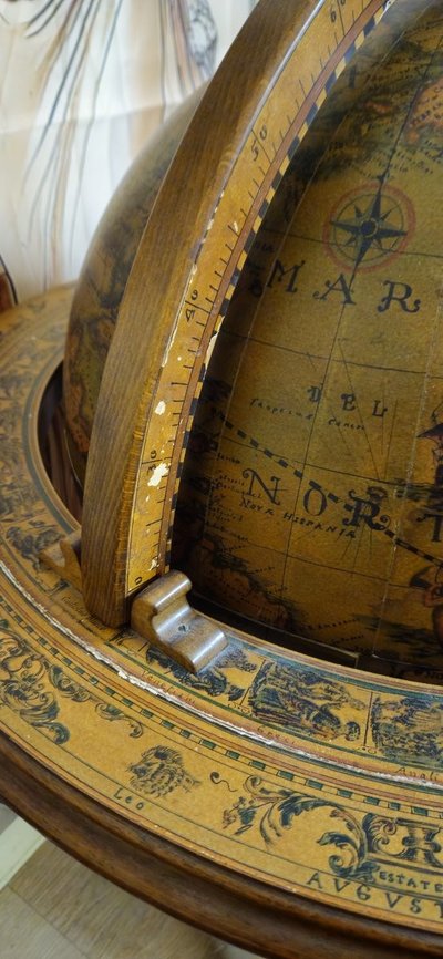 Globe bar opening on tripod base