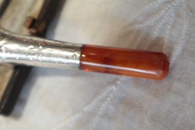 Silver cigarette holder, pipe clay and amber in original leather case, late 19th century