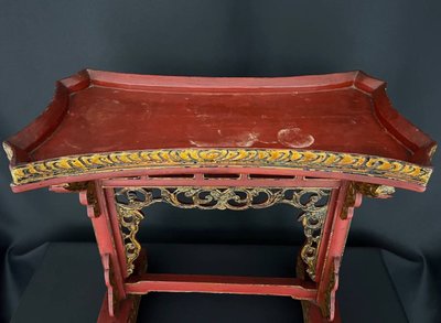 Decorative Asian-style side table in red and gold lacquered wood