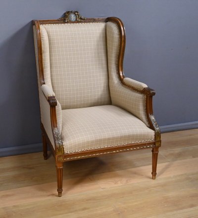 Wingback bergère armchair in walnut, Louis XVI style - Late 19th century